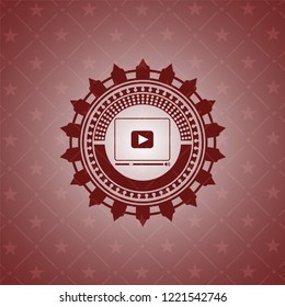 video player icon inside retro red emblem