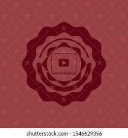 video player icon inside retro red emblem
