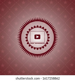 video player icon inside retro style red emblem