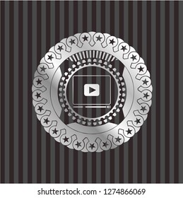 video player icon inside silver badge or emblem