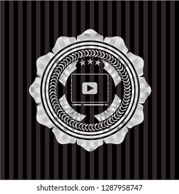 video player icon inside silver emblem