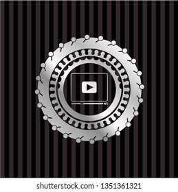 video player icon inside silver emblem or badge