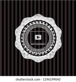 video player icon inside silvery emblem or badge