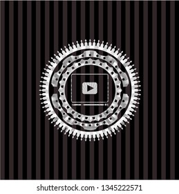 video player icon inside silvery emblem
