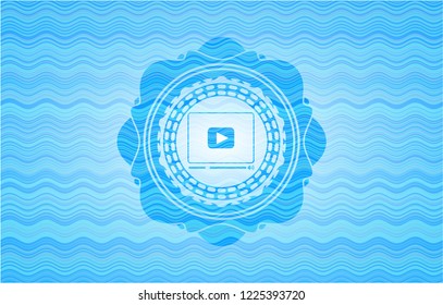 video player icon inside water representation badge background.