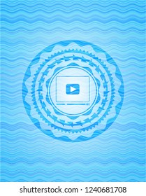 video player icon inside water wave representation emblem background.