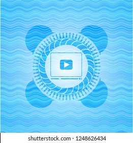 video player icon inside water wave representation badge background.