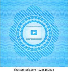 video player icon inside water concept style emblem.