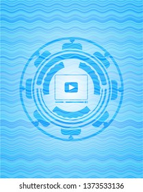 video player icon inside water style emblem.