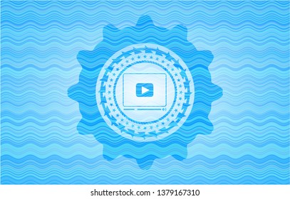 video player icon inside water wave representation badge.