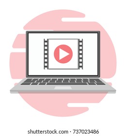 A video player icon on the laptop screen. Vector illustration. Flat.