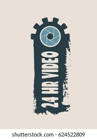 Video surveillance camera. Aperture symbol in gear and brush stroke. 24 hr video text