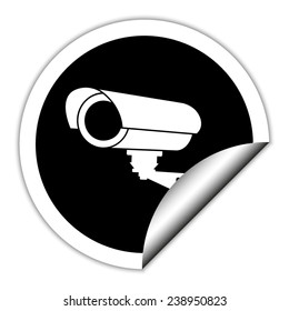 Video surveillance CCTV Camera - black vector icon. Round sticker.