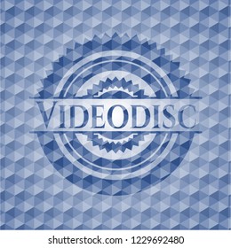 Videodisc blue badge with geometric pattern background.