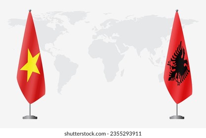 Vietnam and Albania flags for official meeting against background of world map.