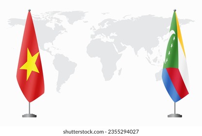 Vietnam and Comoros flags for official meeting against background of world map.