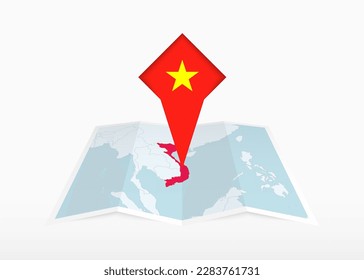 Vietnam is depicted on a folded paper map and pinned location marker with flag of Vietnam. Folded vector map.