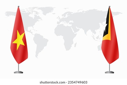 Vietnam and East Timor flags for official meeting against background of world map.