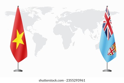 Vietnam and Fiji flags for official meeting against background of world map.