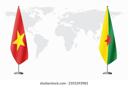 Vietnam and French Guiana flags for official meeting against background of world map.