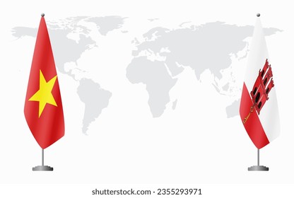 Vietnam and Gibraltar flags for official meeting against background of world map.