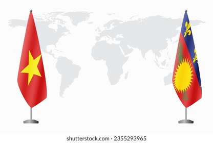 Vietnam and Guadeloupe flags for official meeting against background of world map.