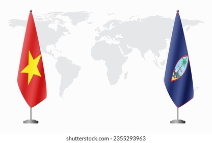 Vietnam and Guam flags for official meeting against background of world map.