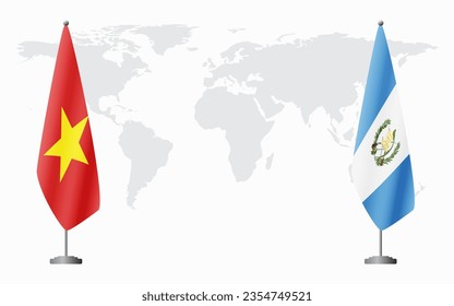 Vietnam and Guatemala flags for official meeting against background of world map.