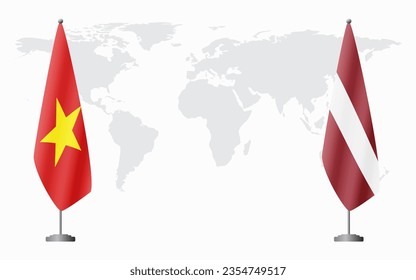 Vietnam and Latvia flags for official meeting against background of world map.