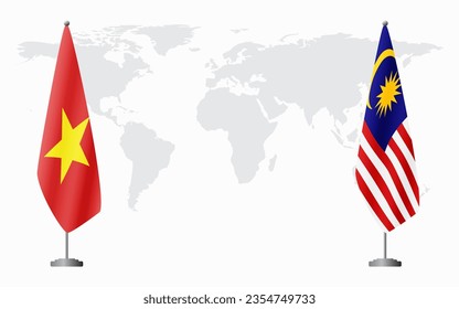 Vietnam and Malaysia flags for official meeting against background of world map.