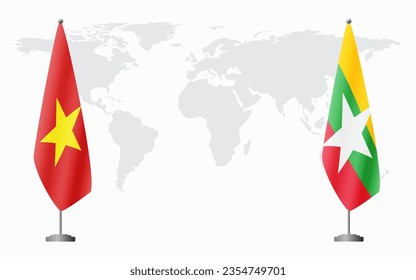 Vietnam and Myanmar flags for official meeting against background of world map.