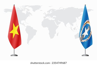 Vietnam and Northern Mariana Islands flags for official meeting against background of world map.