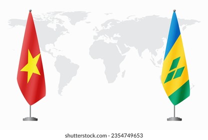 Vietnam and Saint Vincent and the Grenadines flags for official meeting against background of world map.