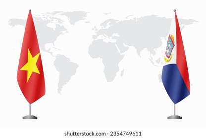 Vietnam and Sint Maarten flags for official meeting against background of world map.