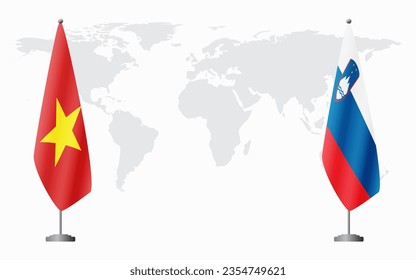 Vietnam and Slovenia flags for official meeting against background of world map.