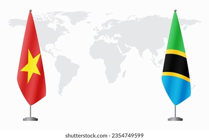 Vietnam and Tanzania flags for official meeting against background of world map.