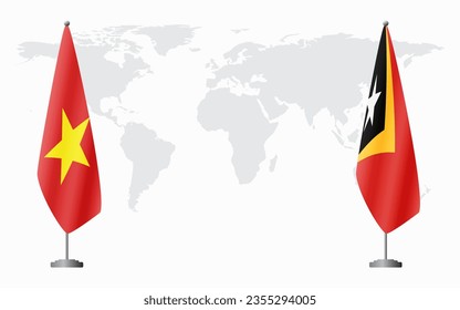 Vietnam and Timor-Leste flags for official meeting against background of world map.