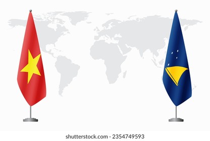 Vietnam and Tokelau flags for official meeting against background of world map.