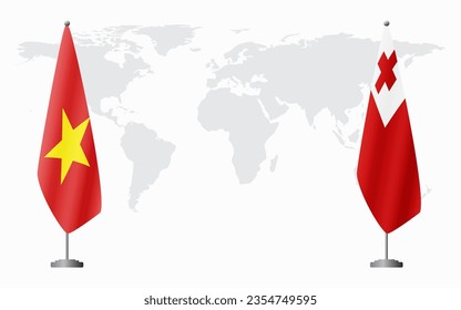 Vietnam and Tonga flags for official meeting against background of world map.