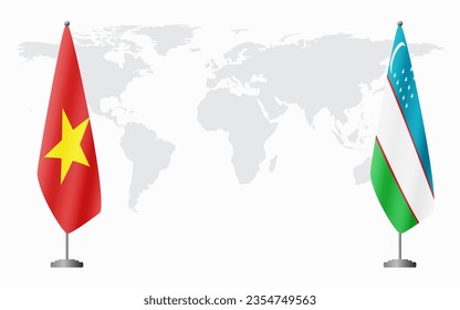 Vietnam and Uzbekistan flags for official meeting against background of world map.