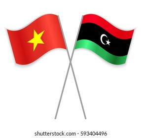 Vietnamese and Libyan crossed flags. Vietnam combined with Libya isolated on white. Language learning, international business or travel concept.