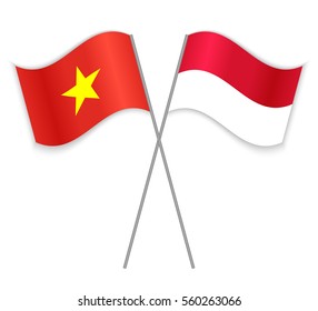 Vietnamese and Monegasque crossed flags. Vietnam combined with Monaco isolated on white. Language learning, international business or travel concept.