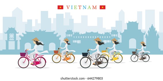 Vietnamese Women with Conical Hat Ride Bicycles, Landmarks Background, Culture, Travel and Tourist Attraction