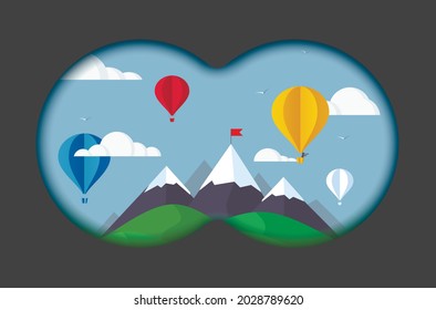 View from binoculars on landscape with mountains and balloons. View binoculars with soft blurry edges.