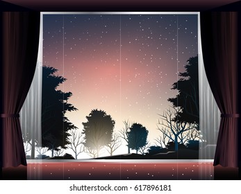 view of deep forest at sunset in room with large window