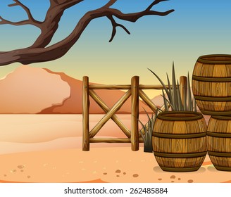 View of the desert with wooden barrels