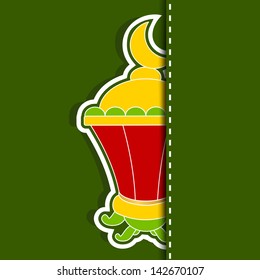 View of intricate Arabic lamp on green background for holy month of Muslim community Ramadan Kareem.