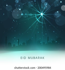 View of a mosque in light of crescent moon and star, holy night for muslim community festival Eid Mubarak. 