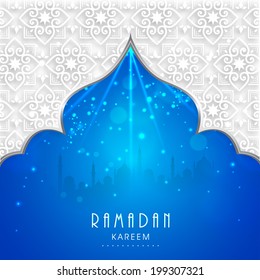 View of mosque in shiny blue night background for holy month of muslim community Ramadan Kareem. 