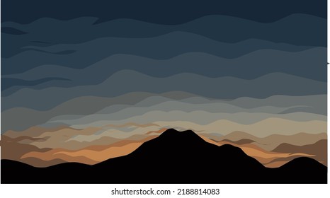 A view of the mountains with the sun setting in the beautiful golden sky